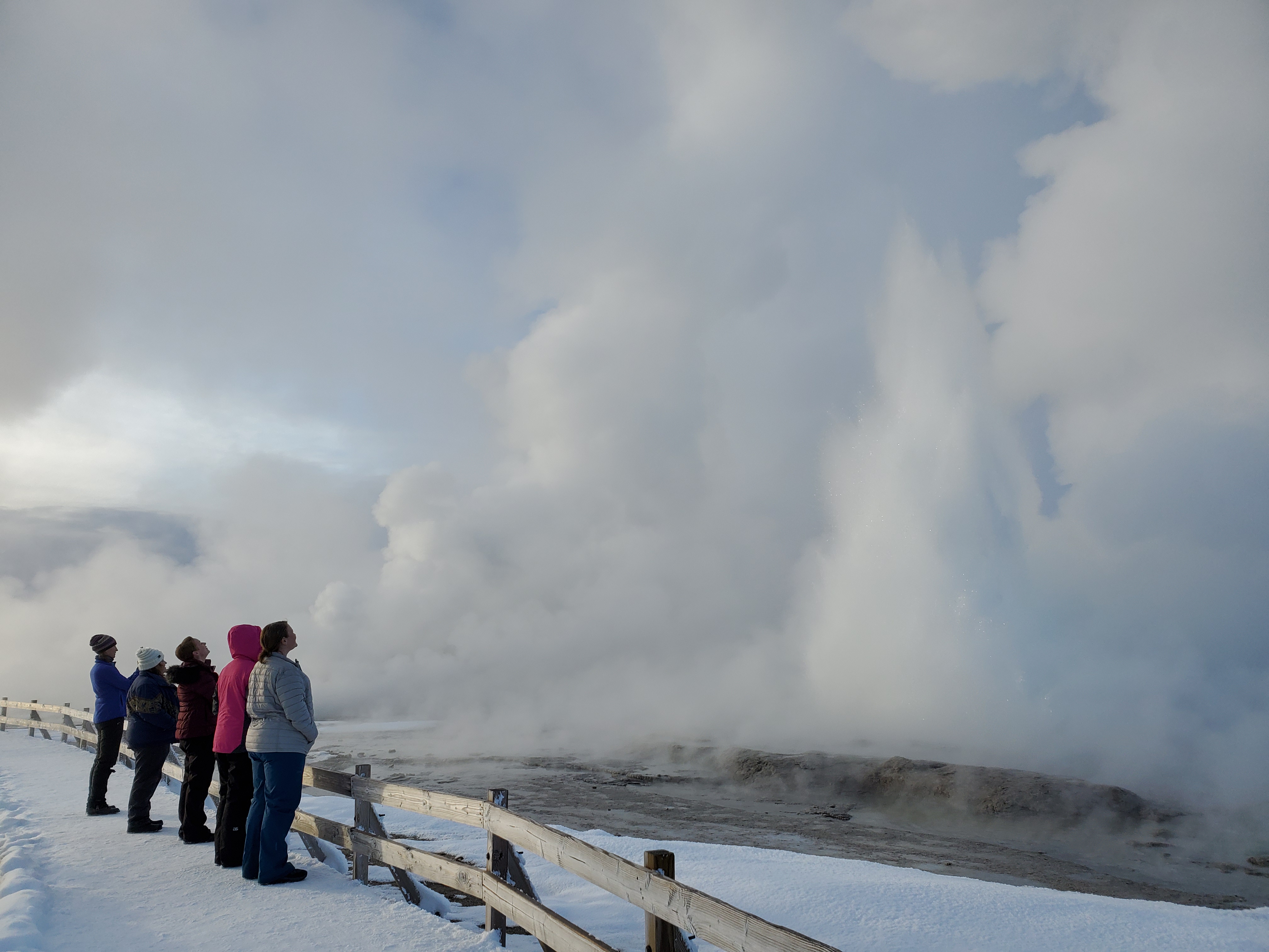 The group watches Fountain geyser erupt.