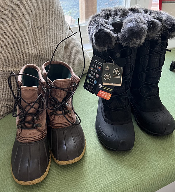 two pairs of boots - one old, one new with tags still attached