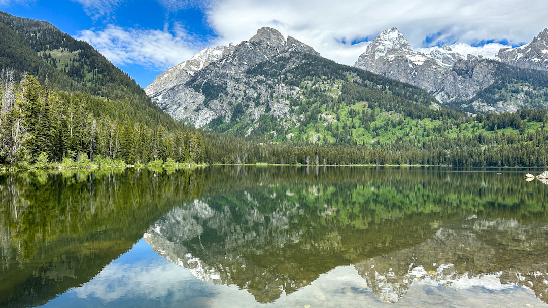mountains reflected in a still lake